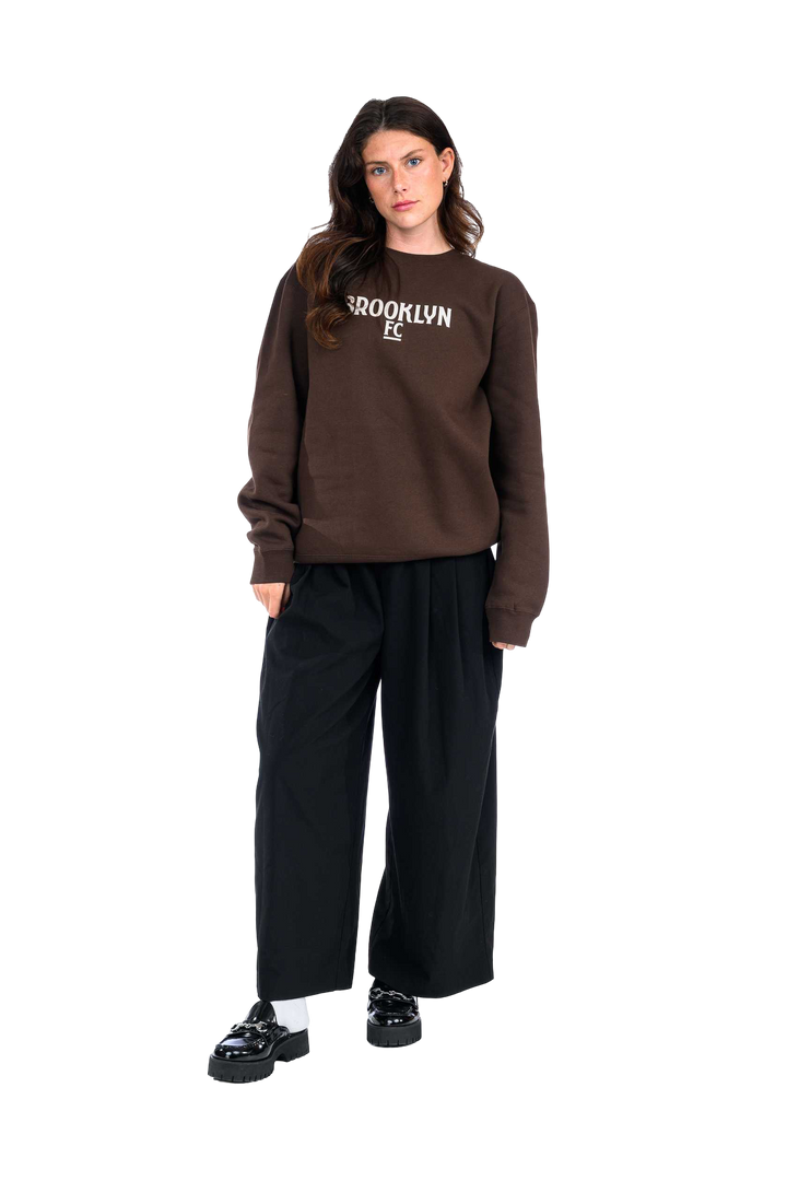 Brooklyn FC Logo Crewneck Sweatshirt in brown – Soft cotton-blend sweatshirt with ribbed cuffs, classic fit, and bold embroidered Brooklyn FC logo. Perfect for everyday wear.