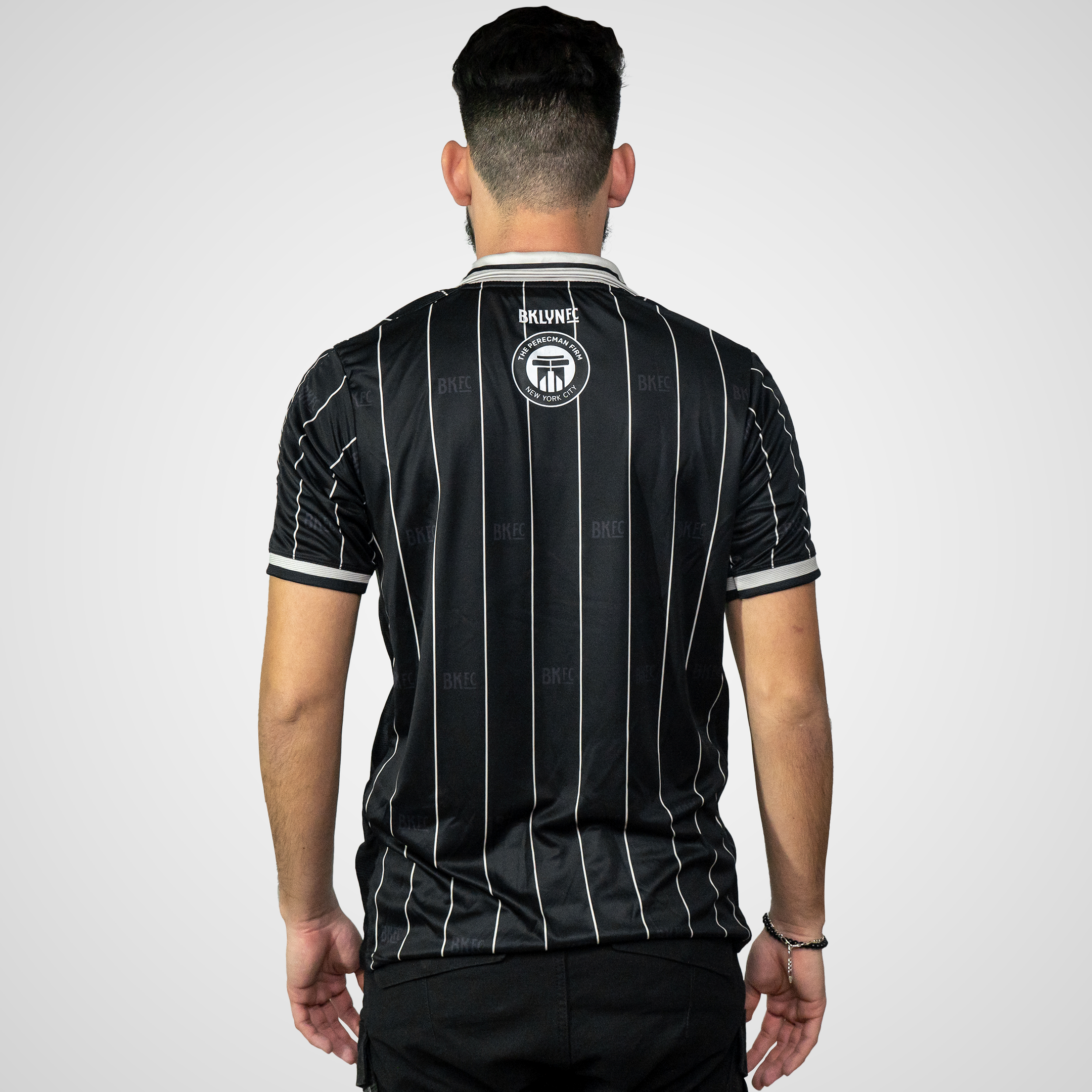 Shop the Brooklyn FC Home Jersey for men. Featuring breathable, moisture-wicking fabric, official team crest, and sponsor branding for authentic match-day style. Back View.