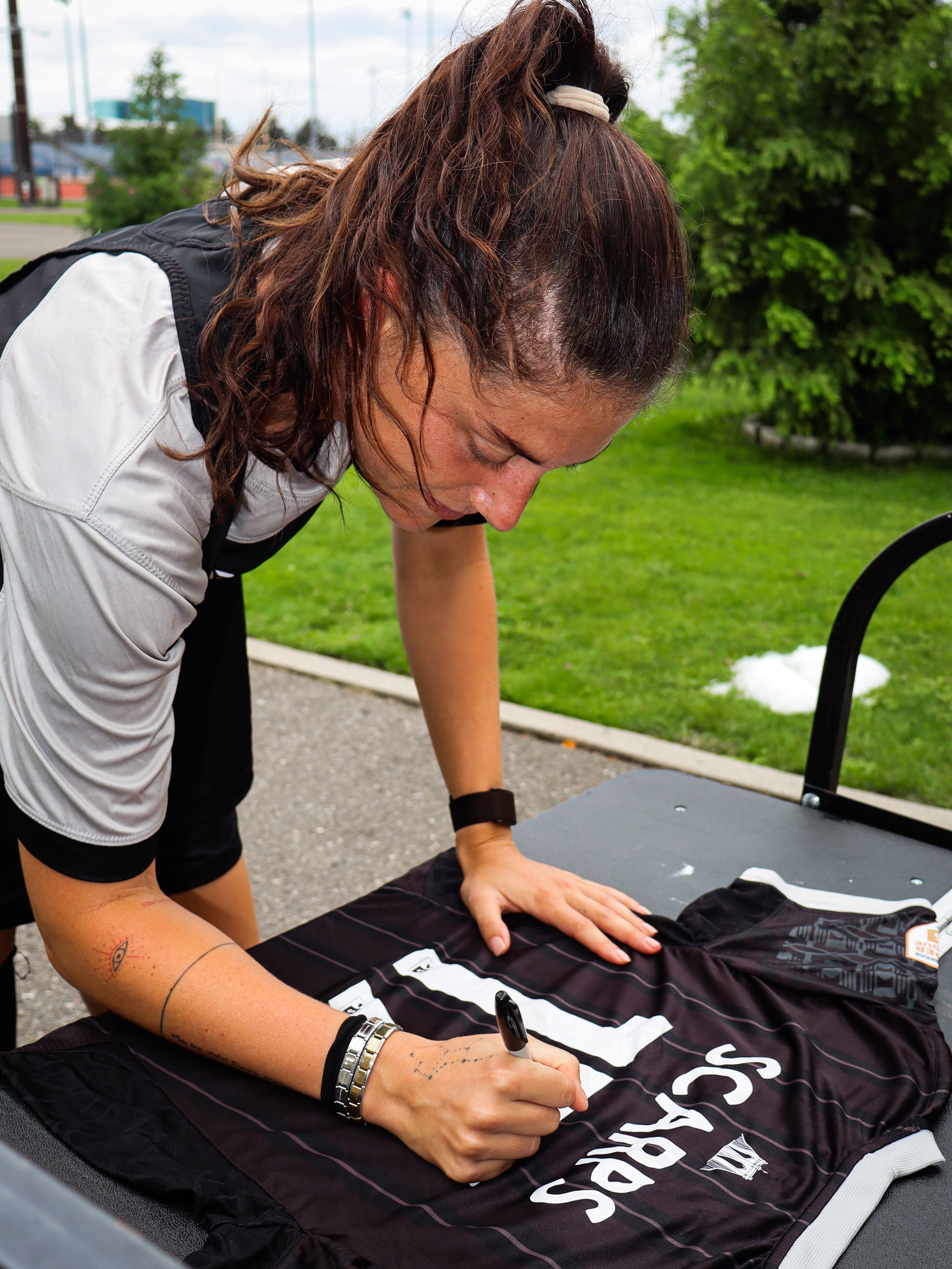 Leah Scarpelli (Scarps) Signed Jersey - Leah signing 1