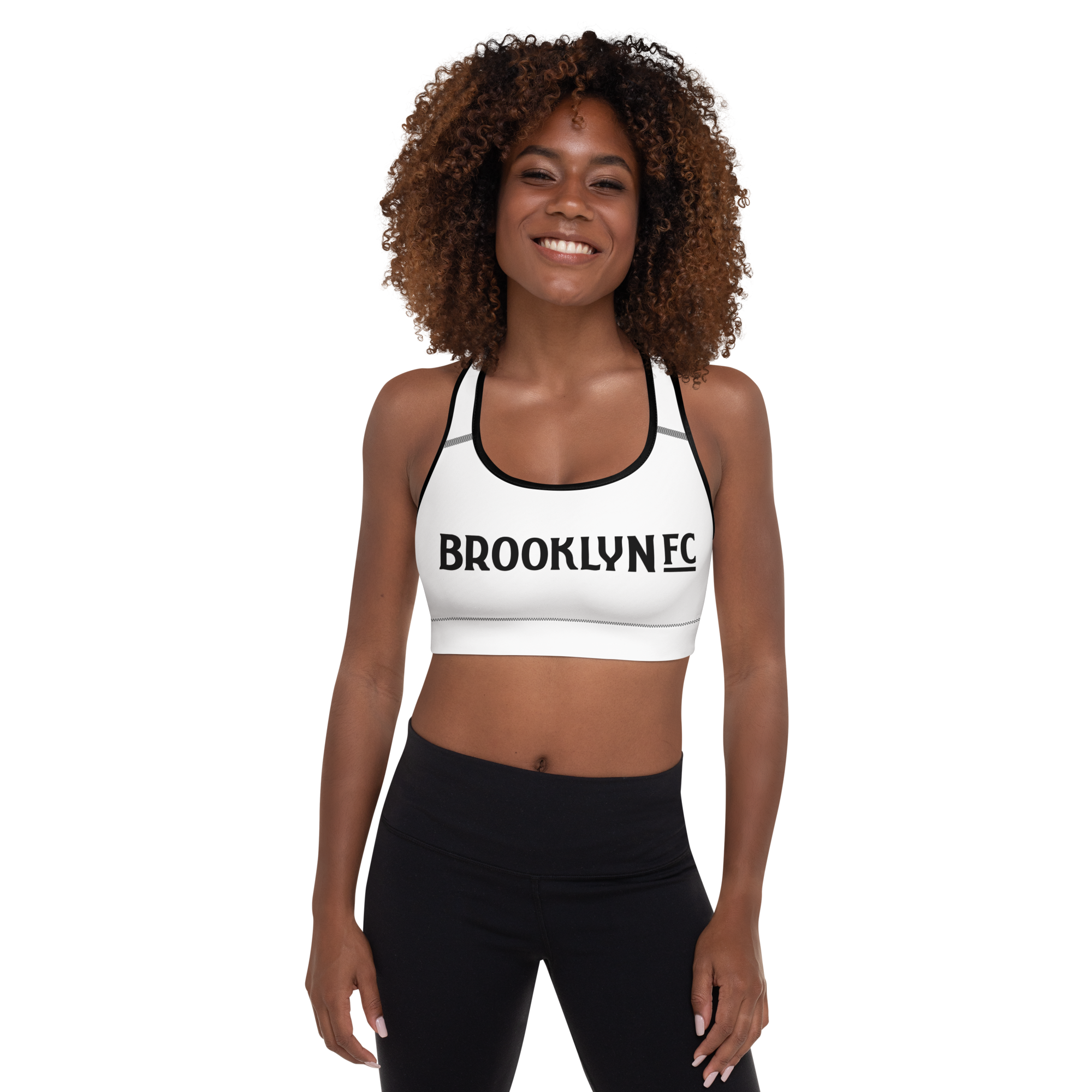 Brooklyn FC black padded sports bra with racerback, removable perforated foam padding, mesh lining, and wide under-bust elastic.