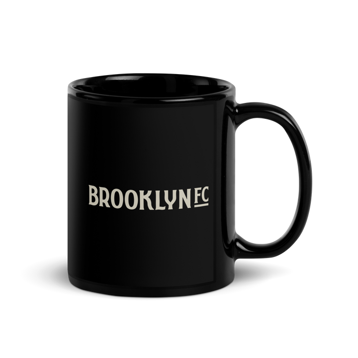 Black ceramic Brooklyn FC coffee mug with official wordmark in bold white lettering.