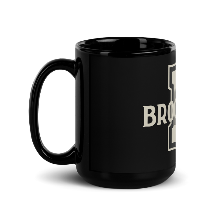 Black ceramic Brooklyn FC coffee mug with official wordmark in bold white lettering.