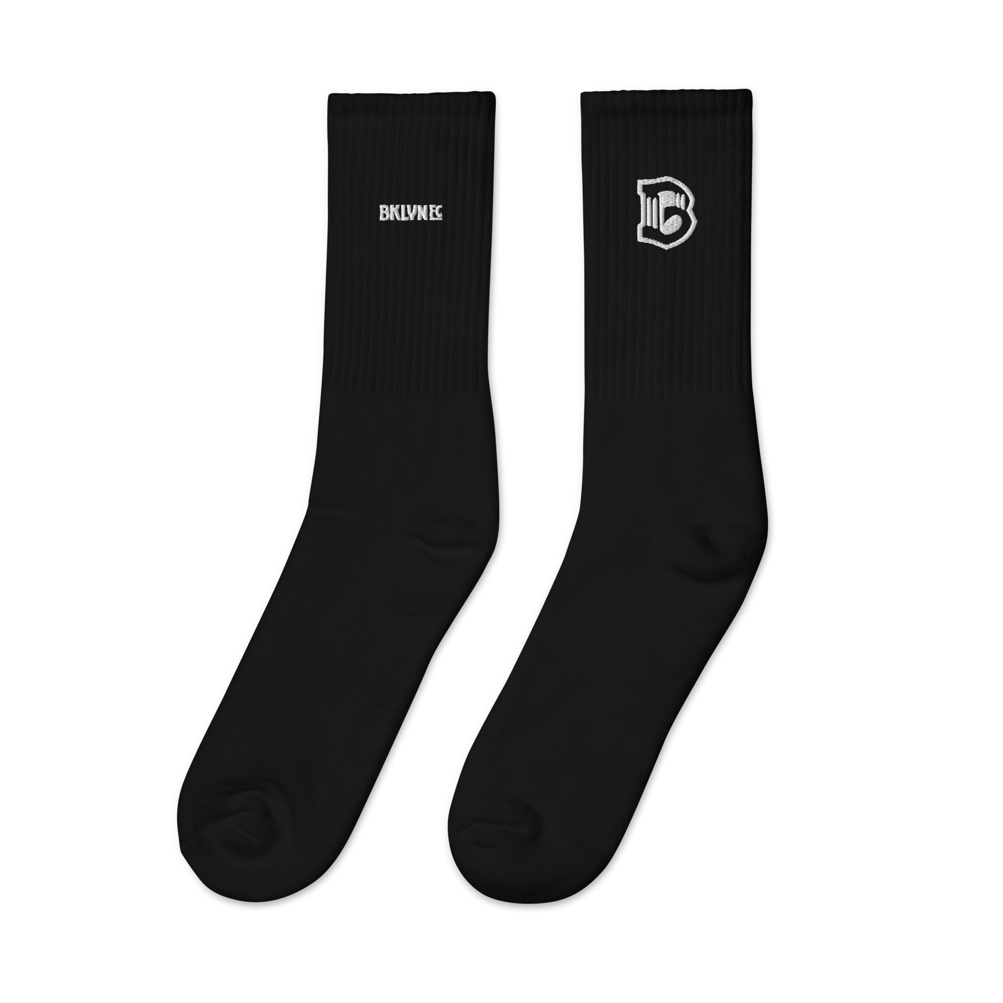 Pair of Brooklyn FC mid-calf socks in cotton-polyester-spandex blend with cushioned sole, embroidered crest, and logo-watermark soles.