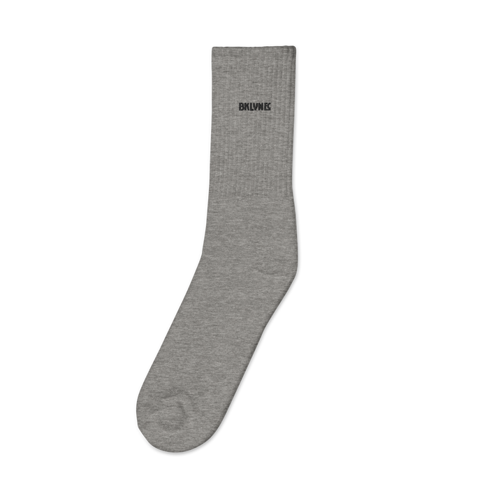 Pair of Brooklyn FC mid-calf socks in cotton-polyester-spandex blend with cushioned sole, embroidered crest, and logo-watermark soles.